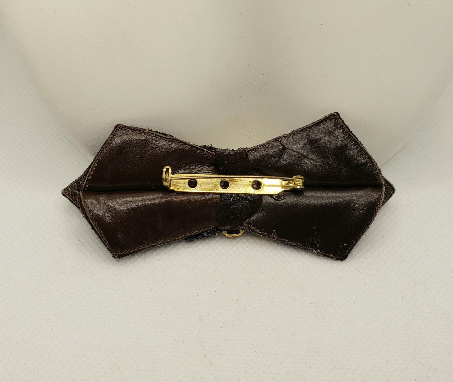Brown leather bow tie pin