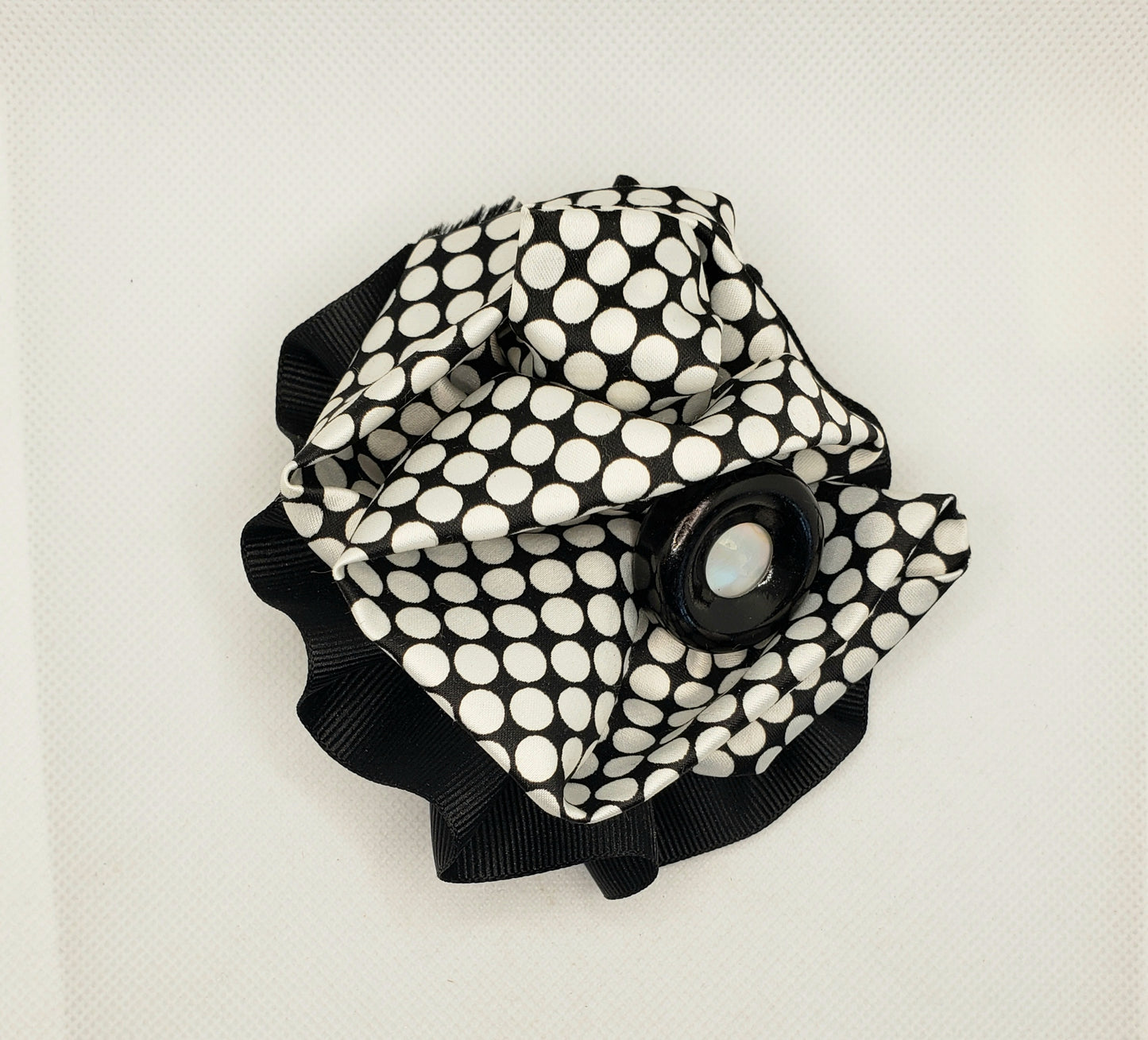 Black and white checked broach