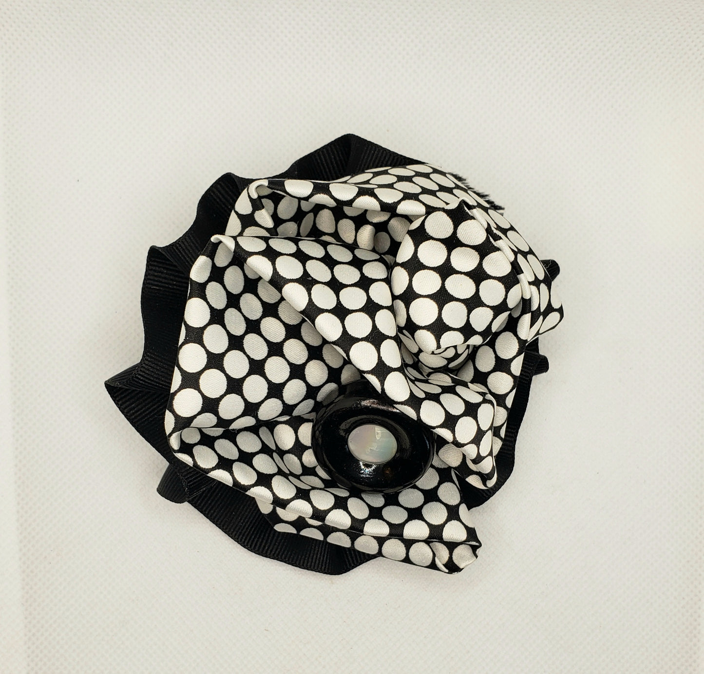 Black and white checked broach